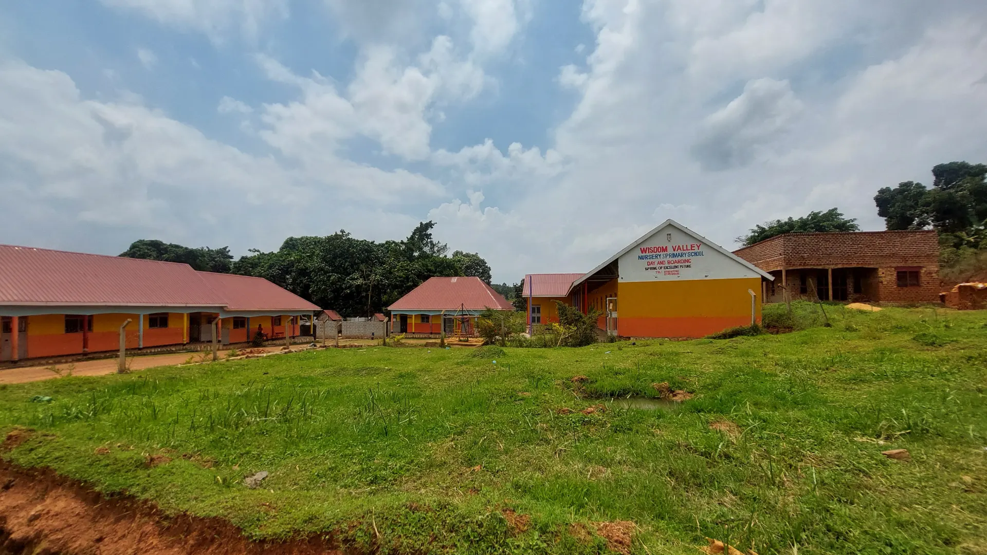 Wisdom Valley Nursery and Primary School campus and school sign in Wakiso