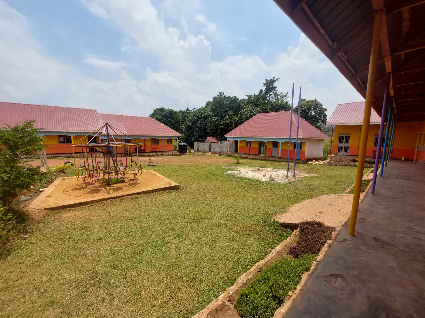 Covered walkway looking across the Wisdom Valley school courtyard